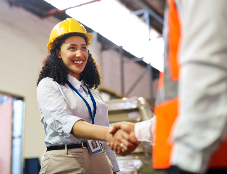 Business, woman and engineer handshake